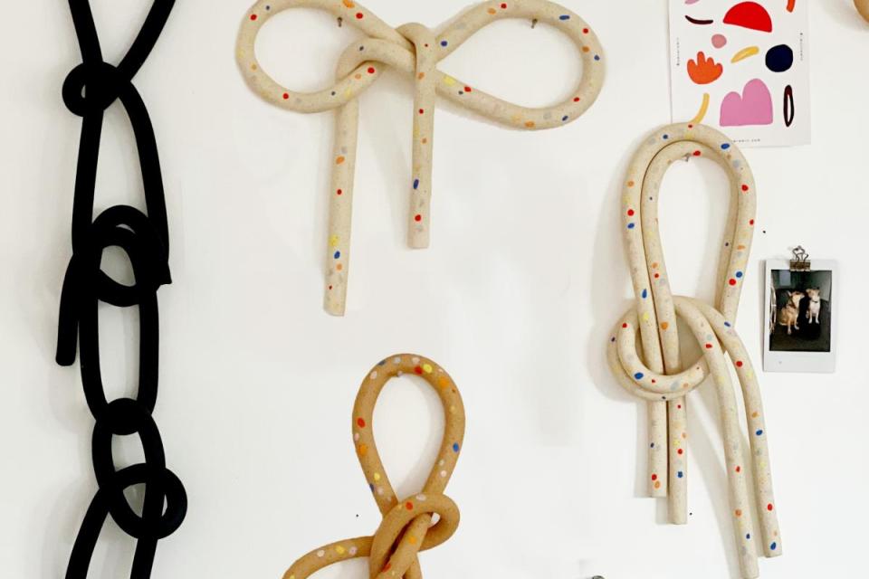 clay knots displayed on wall